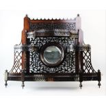 An early 20th century Chinese Chippendale revival mahogany wall shelf, of fretwork form, the central