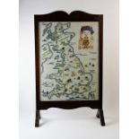 An embroidery sampler, mid 20th century, depicting a map of the British Isles embellished with