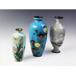 A Japanese cloisonne vase, in the manner of Hattori Tadasaburo, decorated with lilies against a