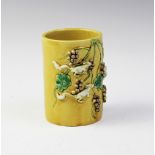 A Chinese porcelain Sancai glazed brush pot/bitong, 19th/20th century, of cylindrical form and