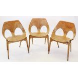 Two 'Jason' chairs designed by Carl Jacobs for Kandya, mid 20th century, the seats formed from one