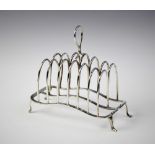 An Edwardian six division silver toast rack by William Hutton & Sons, London 1906, with loop