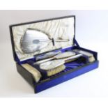 A boxed silver mounted dressing table set by Charles S Green & Co Ltd, Birmingham 1926, comprising a