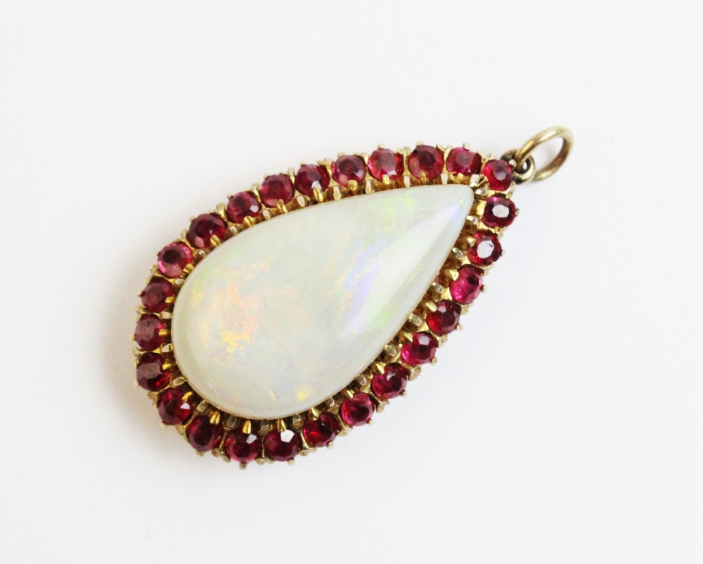 An opal and untested ruby set pendant within a fitted Wartski case, the pear shaped opal - Image 3 of 5