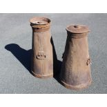 A pair of conical milk churns and covers, of typical form, one cover with copper name plate