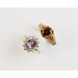 A Victorian garnet set 9ct gold ring, Birmingham 1890 comprising a central oval cut garnet measuring