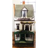 A late 20th century hand made custom built dolls house, circa 1980's, the house modelled as a