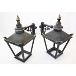 A pair of early 20th century painted metal wall mounted outdoor lanterns, of pagoda form with a