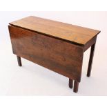 A late 18th/early 19th century oak single drop leaf table, the rectangular top above a plain frieze,