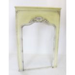 A late 19th/early 20th century French painted mirror surround, the yellow painted frame applied with