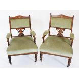 A pair of Edwardian rosewood parlour chairs, each with a padded back rest above an inlaid and open