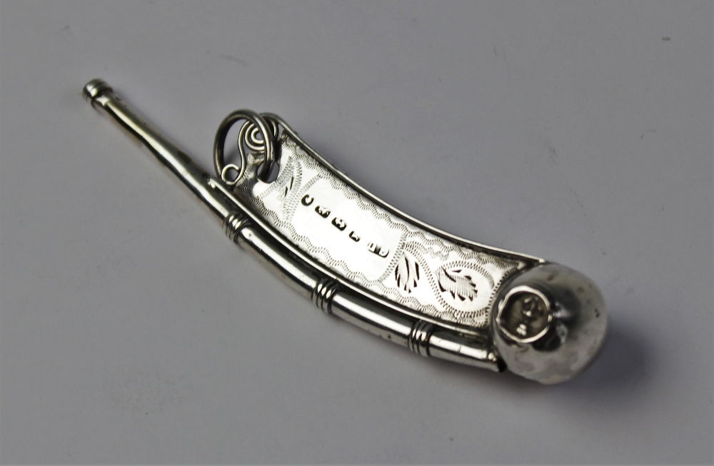 A Victorian silver bosun's whistle by George Unite, Birmingham 1859, of typical form with embossed