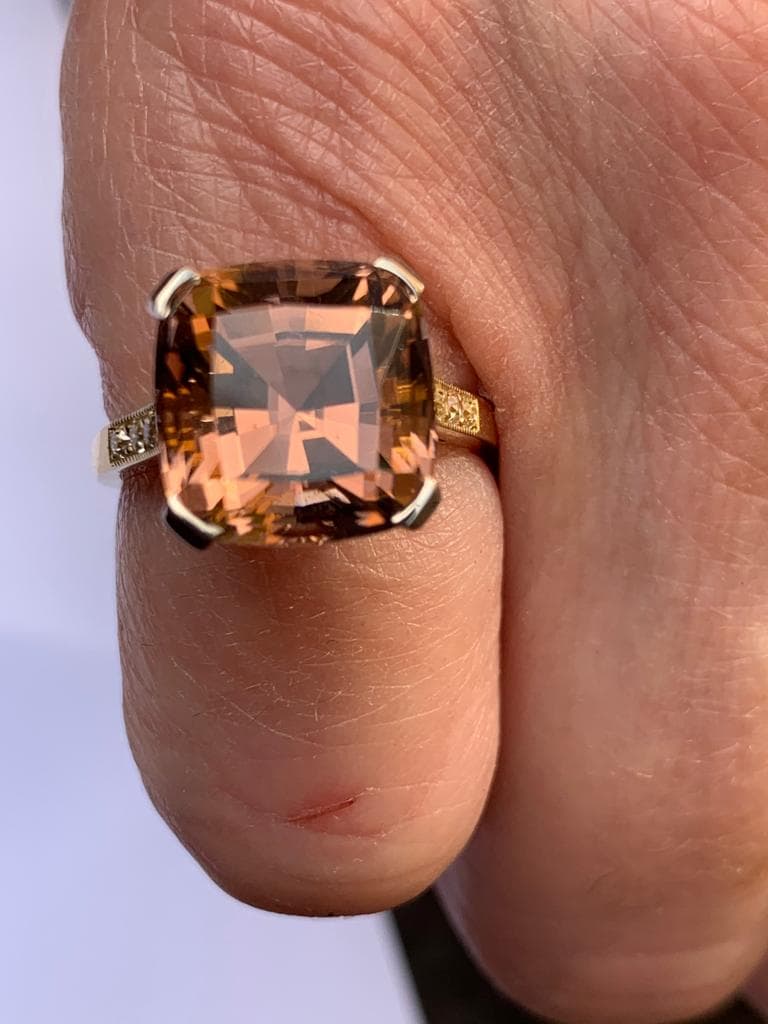 A tourmaline and diamond ring, comprising a central pinkish-orange square cushion cut tourmaline - Image 8 of 8