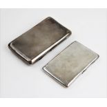 A George V silver cigarette case by Cohen & Charles, London 1930, of rectangular form with engine