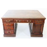 A late Victorian mahogany partners desk, the rectangular moulded top inset with a gilt tooled tan