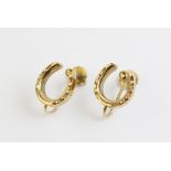 A pair of 9ct earrings in the form of horseshoes, 11mm x 12mm, with screwback fastenings, weight 3.