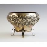 An Arts & Crafts silver bowl by Elkington & Co, London 1901, of tapering baluster form on three