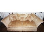 A modern knole type three seater settee, in taupe coloured fabric, the drop ends with acorn shaped