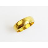 A 22ct gold wedding band, ring size L, weight 5.8gms