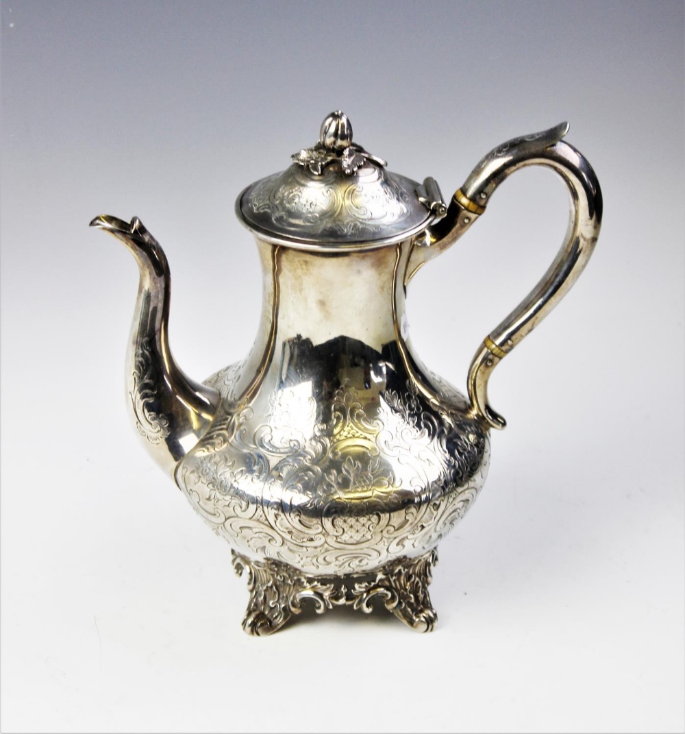 A Victorian silver coffee pot by John Wellby, London 1843, of baluster form on four scrolling - Image 4 of 4