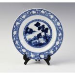 A Chinese porcelain blue and white plates, 18th century, of circular form, centrally decorated
