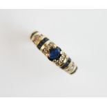 A sapphire and diamond 15ct gold ring, comprising a central oval mixed cut sapphire measuring 5mm