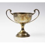 A silver twin-handled pedestal trophy cup by F Johnson & Sons, Birmingham 1933, the circular bowl