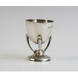 A silver Arts & Crafts egg cup by Philip Hanson Abbot, London 1912, the tapered bowl on curved
