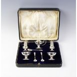 A George V cased silver condiment set, George Unite Birmingham 1915, each piece of plain polished,
