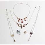 A selection of vintage necklaces and pendants, to include an Arts and Crafts style pendant in the