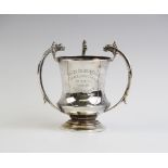 A silver and silver gilt Arts & Crafts style trophy cup by Robinson & Co, Birmingham 1935, of
