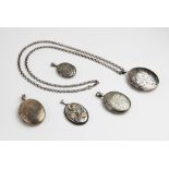 A selection of silver and white metal locket pendants, to include a mid-twentieth century large