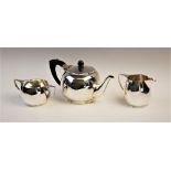 A mid-twentieth century three piece silver tea set, marked for 'EAH', Chester 1949 - 1954,