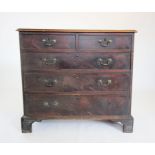 A George III mahogany chest of drawers, the rectangular moulded top above two short and three long