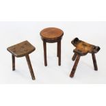 A 19th century elm milking stool, the 'D' shaped seat raised upon three chamfered legs, 39cm high,