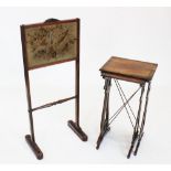 A mid 19th century rosewood fire screen, the rectangular needlepoint screen depicting two birds