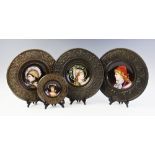 Three French ceramic portrait plates, late 19th/early 20th century, each set to a pressed