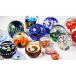 A collection of twenty one paperweights, 20th century, by Caithness, Selkirk, Strathearn, Murano and
