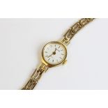 A lady's vintage 9ct gold Accurist Quartz wristwatch, the circular pearlescent dial with baton
