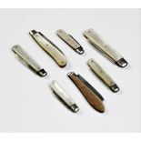 Seven Victorian and later silver bladed folding fruit knives, each with mother of pearl handles, the