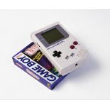 A 1989 Nintendo Gameboy, model number DMG-01, serial number G281 84774, with an unboxed Tetris