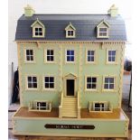A late 20th century hand made custom built dolls house, circa 1981, the twelve room house of
