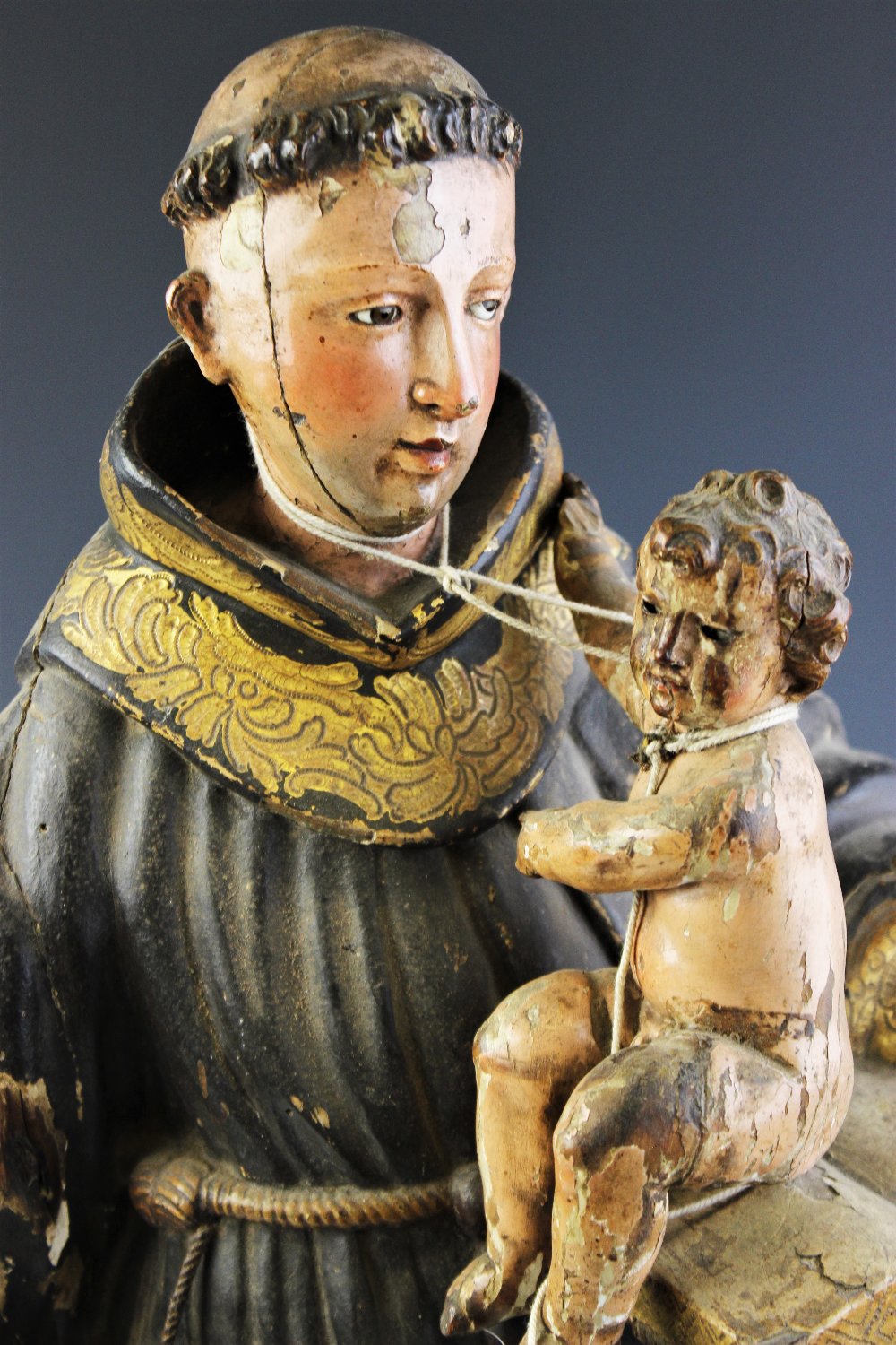 An Italian carved painted wood and gesso figural carving of St. Anthony of Padua and Infant - Image 2 of 3