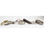 A collection of six assorted silver bangles, to include hollow, solid and filled examples, and two