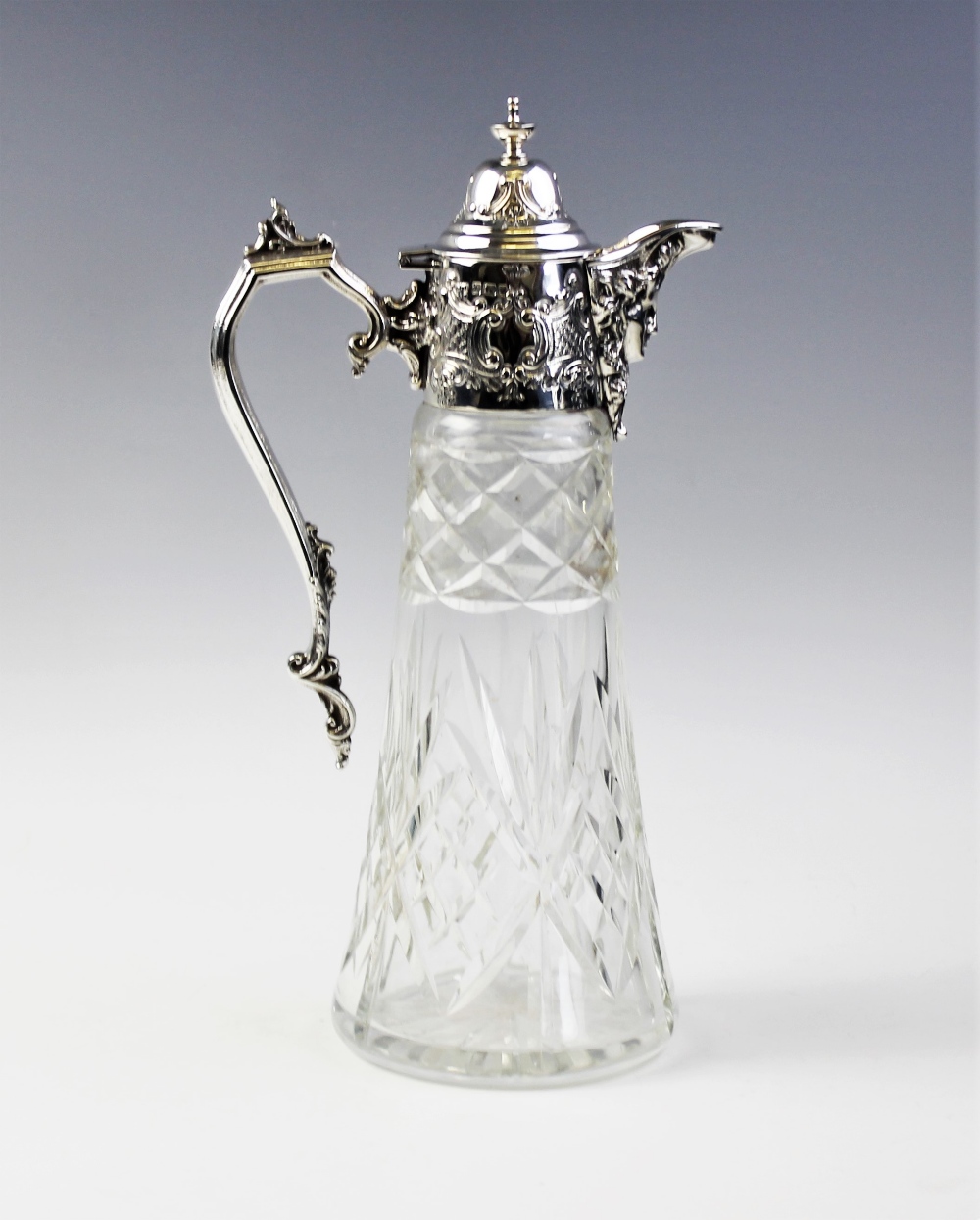 An Edwardian silver mounted cut glass claret jug, Sheffield 1905, of tapering form with star cut