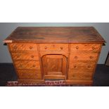 A Victorian satinwood knee hole dressing table/desk, the rectangular thumb moulded top above a