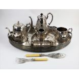 A three piece silver plated tea set, comprising: a teapot, cream jug and sugar bowl, together with a