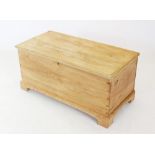 A Victorian pine blanket chest, the interior with a fitted candle box, raised upon bracket feet,