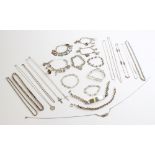 A selection of silver jewellery, to include a silver tag bracelet, five silver charm bracelets set