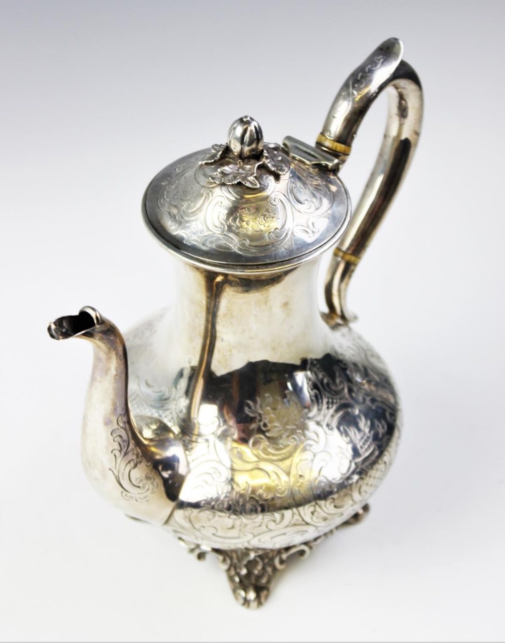 A Victorian silver coffee pot by John Wellby, London 1843, of baluster form on four scrolling - Image 2 of 4